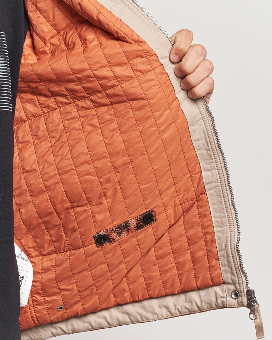 Stone Island Earth Mapping Camo cotton canvas overshirt jacket with PrimaLoft insulation technology.