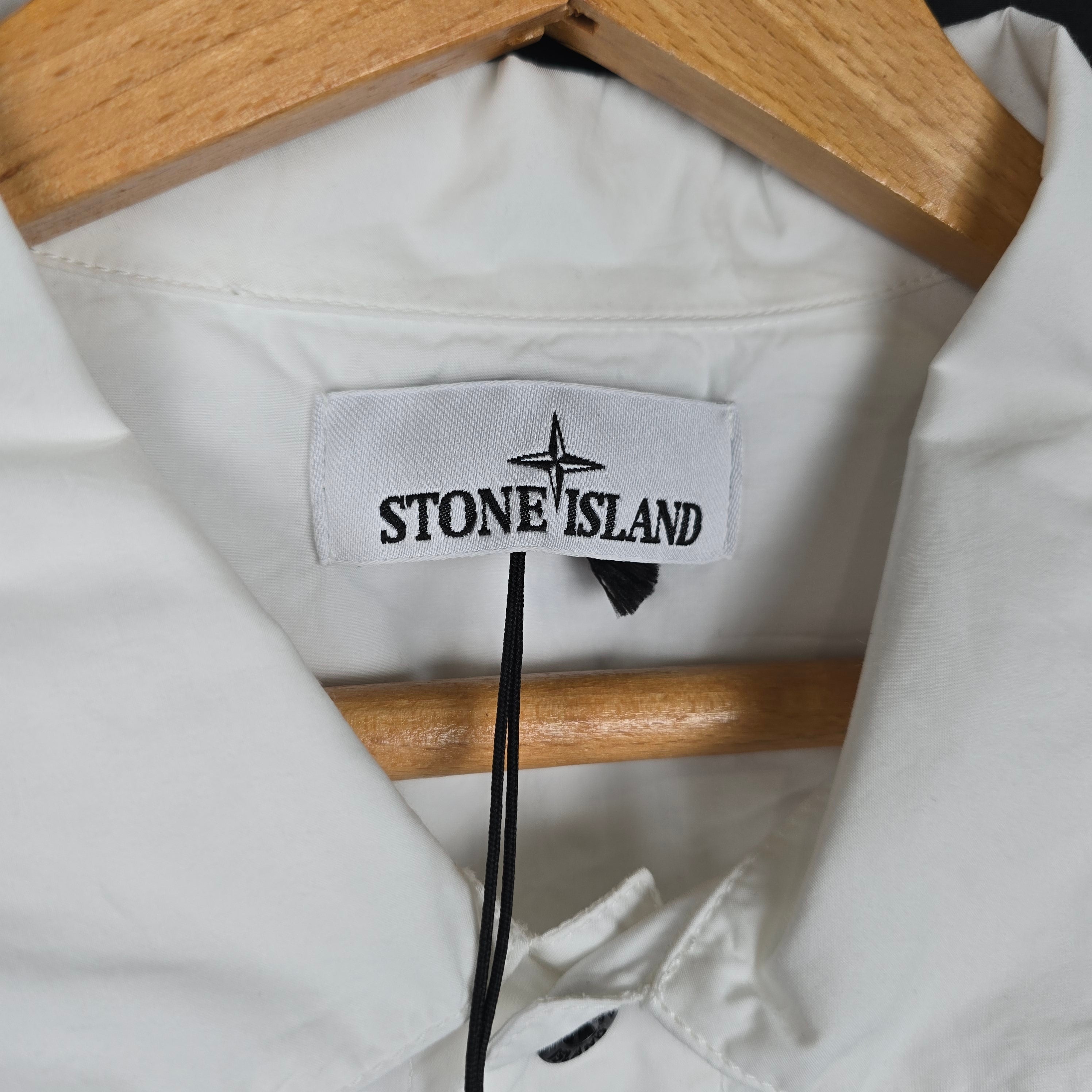 Stone Island white short sleeve shirt front view on hanger
